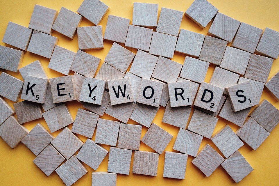 SEO content writing involves keyword research (image of keywords spelled in scrabble tiles)